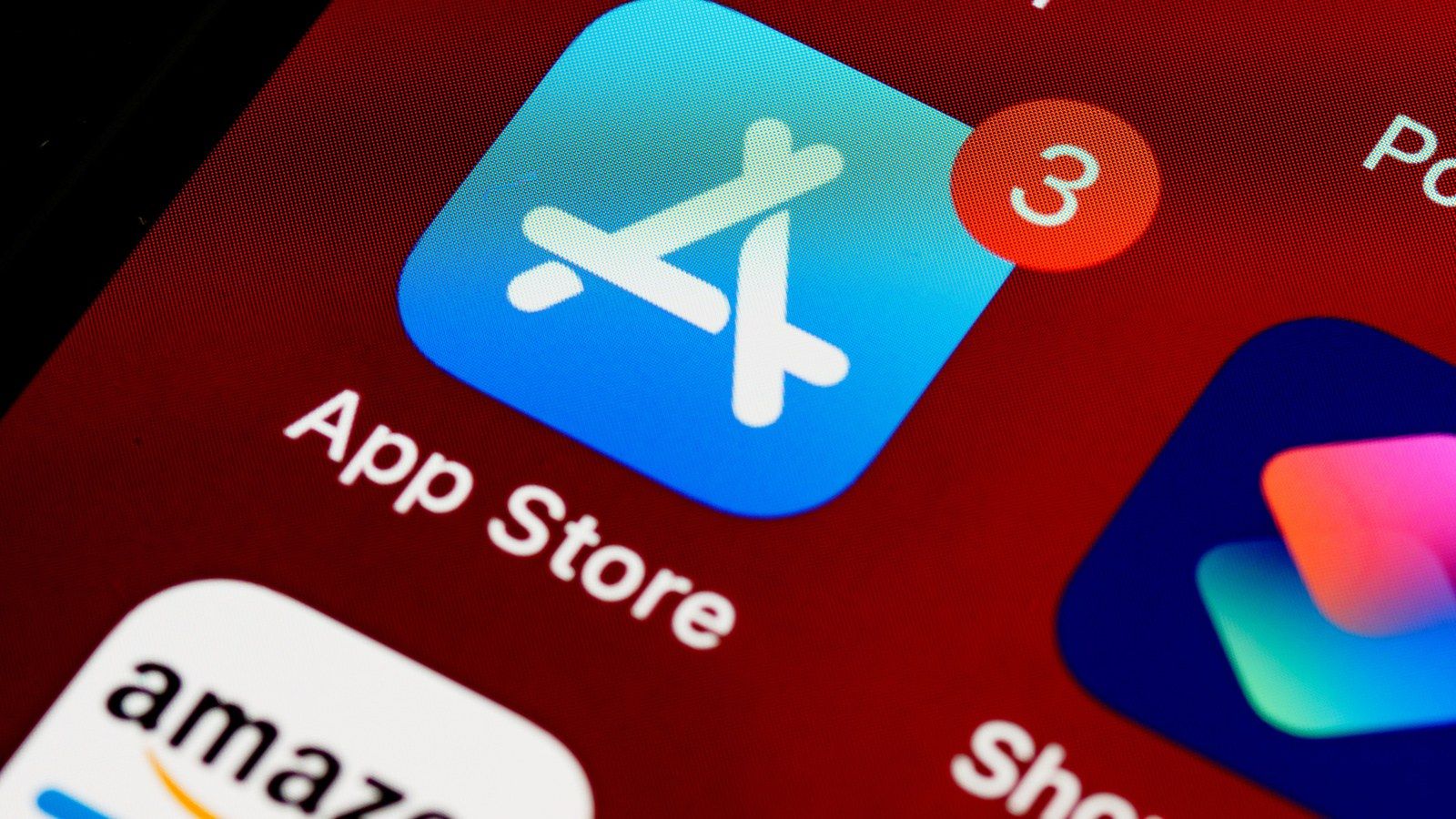 Close-up of the real Apple App Store icon on a phone screen