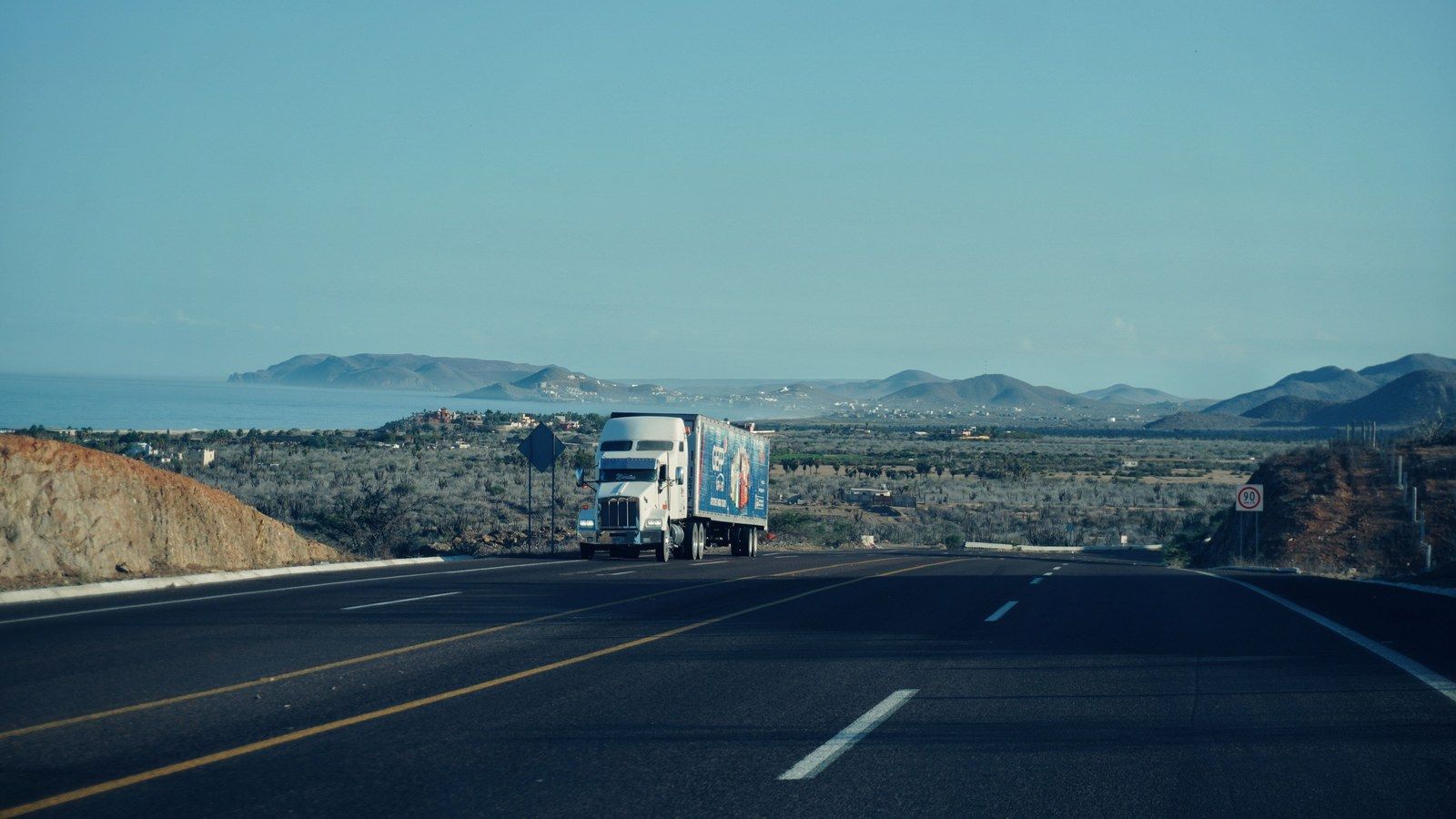 Stock photo of a semi truck on a highway, illustrative only, not an actual Einride or Tesla Semi vehicle