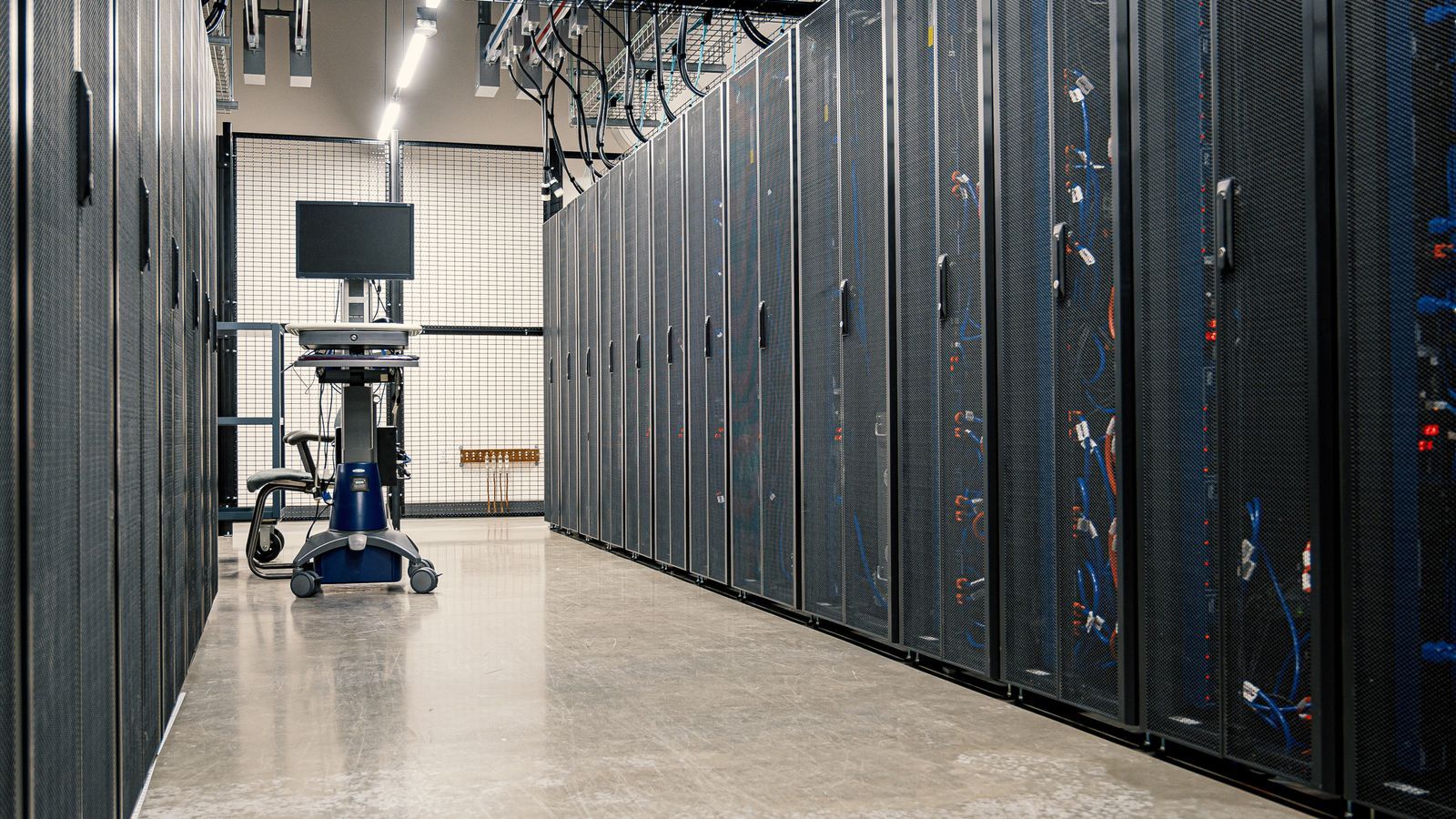 Stock photo of server racks in a data center, illustrative only, not an actual OpenAI facility