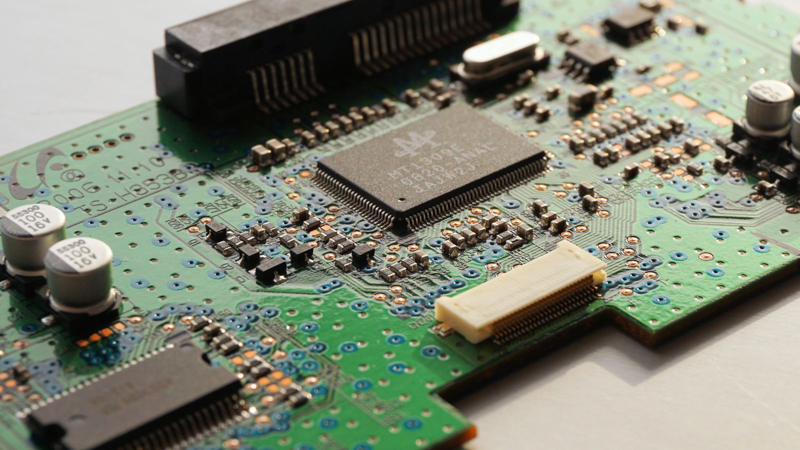 Stock photo of a green computer circuit board, illustrative only, not an actual Marvell or Google chip
