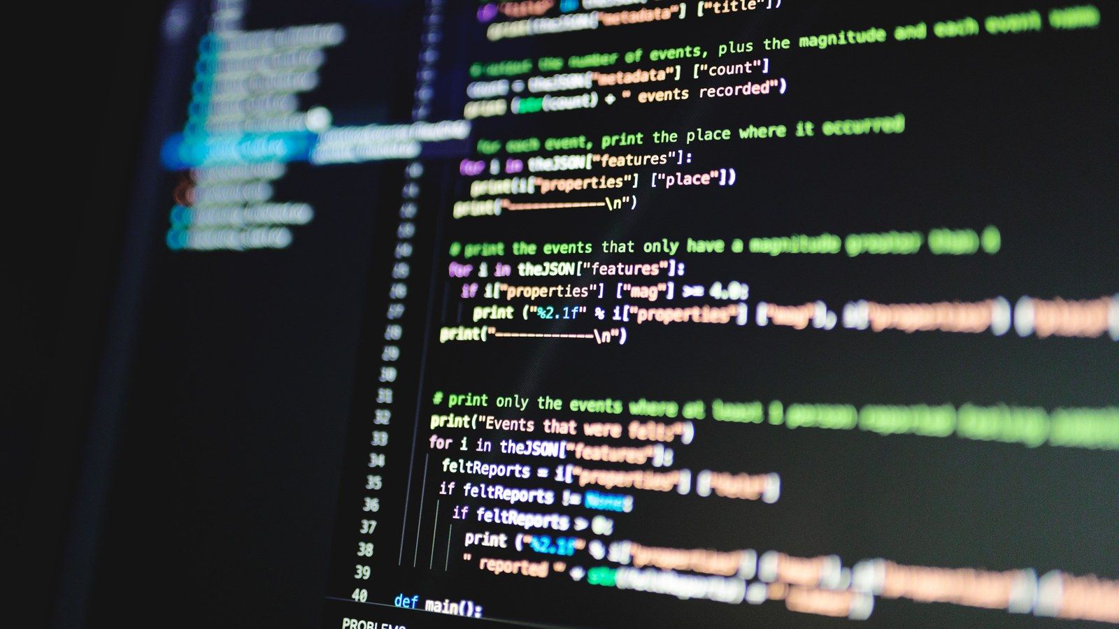 Stock photo of syntax-highlighted source code displayed on a monitor